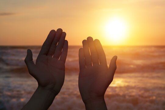 hands hold sun light on beautiful sky background