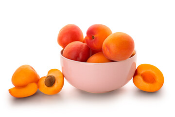 Bowl with ripe apricots isolated on white background