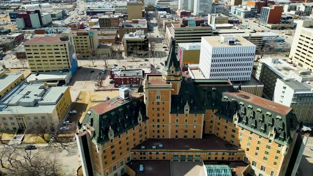 Aerial view of the downtown area of Saskatoon, Saskatchewan, Canada. Reveal of Marriott Bessborough Hotel in the middle of Downtown Saskatoon, Saskatchewan, Canada