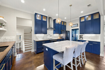 home kitchen with navy blue accents and white tile 