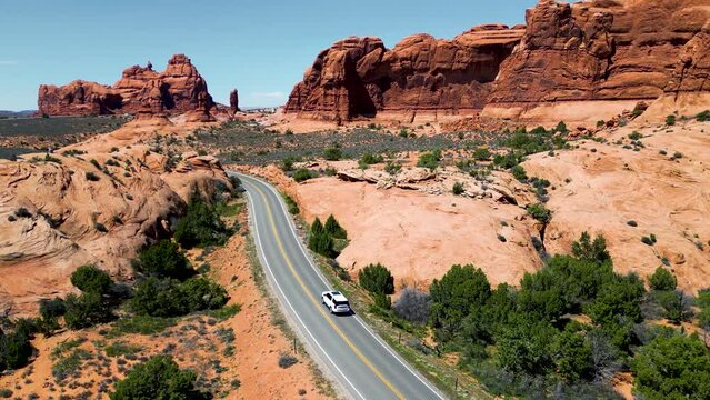 Family car trip to the Utah, USA. Top Cinematic aerial view. American background video. Drone 4K footage. Cinematic aerial view over the sunny a red rock of mountain Zion National Park Utah US. 