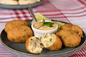 Fried codfish fritter typical Portuguese and Brazilian cuisine fish with herbs.