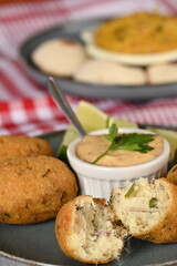 Fried codfish fritter typical Portuguese and Brazilian cuisine fish with herbs.