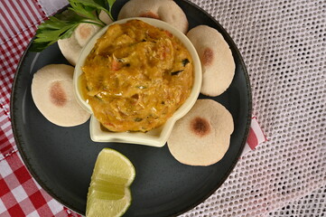 cod moqueca, fish cream with olive oil and flatbread.