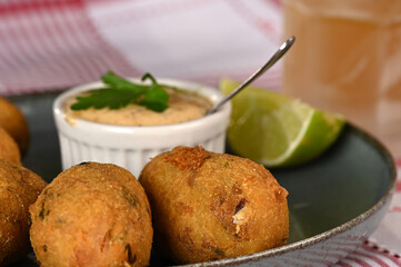 Fried codfish fritter typical Portuguese and Brazilian cuisine fish with herbs.