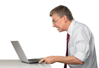 Frustrated businessman using a laptop