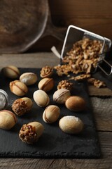 Freshly baked homemade walnut shaped cookies on wooden table
