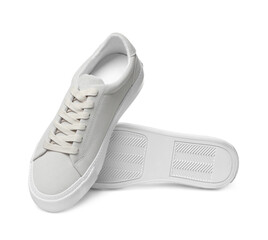 Pair of stylish beige sneakers isolated on white