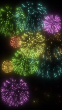 Colorful fireworks exploding on black background. vertical footage for social media background.
