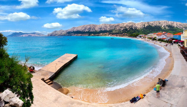 Baska on the island of Krk. Beautiful romantic summer scenery on the Adriatic Sea. Large beach in the harbor with crystal clear blue water. Croatia. Europe.