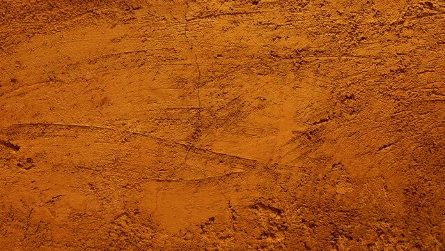 Golden brown plaster wall texture background with scratch and crack pattern