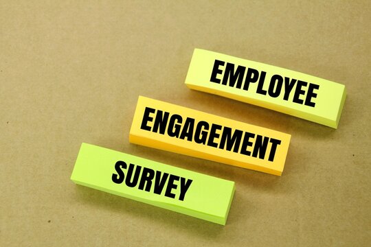 colored paper with the word Employee Engagement Survey. the concept of employee involvement in the field