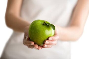 Closeup of a Woman Holding an Apple