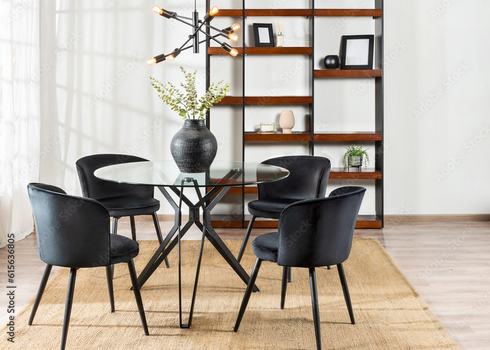 Wall mural interior shot of a modern style dining room area, featuring a wooden table with four chairs, a books