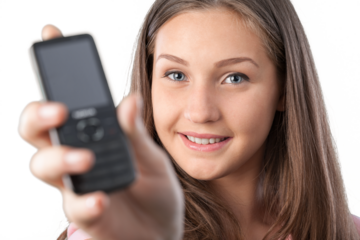 Close-up portrait of young woman with phone isolated on white background