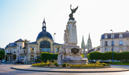 Place de la République ("Republic's Square") in Soissons, France - Roundabout with a classic sculpture celebrating freedom topped with a winged angel carrying a torch
