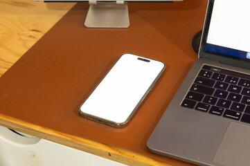 mobile phone with password page on working desk and leather sofa