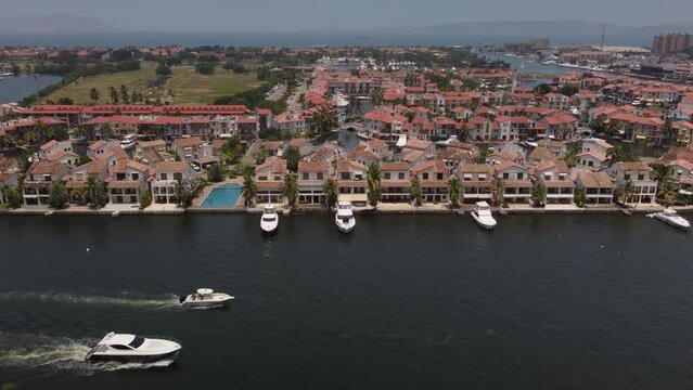 Yachts sailing through a water channel in the city of Lecher&iacute;a, northern Anzo&aacute;tegui state, Venezuela