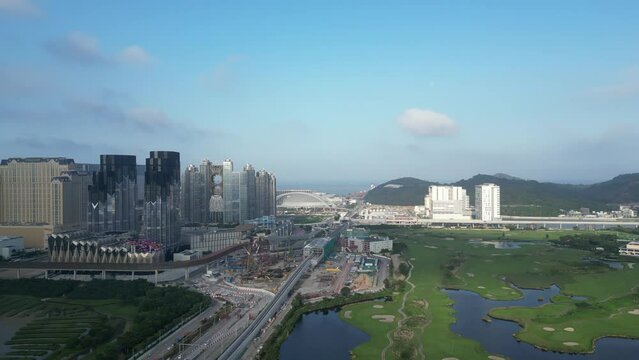 Panning aerial view of Macau Cotai casino hotel area