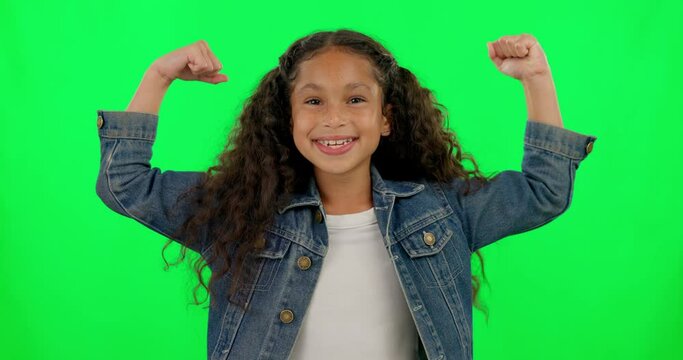 Face, green screen and girl flexing arms, smile and confident kid against a studio background. Portrait, female child or toddler flex, muscle and success with challenge, power and strength with pride