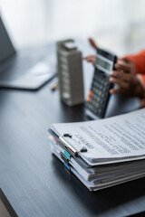 African American realtor working at desk, Housing estate, Vacancy, Prime location, Description of...