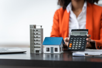 African American realtor working at desk, Housing estate, Vacancy, Prime location, Description of...