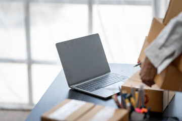 Pretty young african american woman startup freelancer business people is working at warehouse for online store.