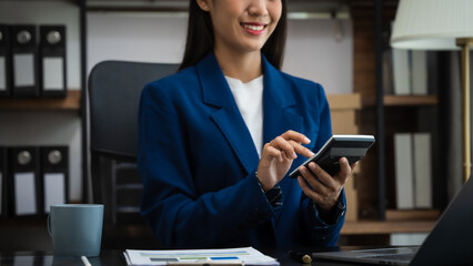 Young chinese business woman doing bookkeeping analyst audit working papers, public offering, cash...