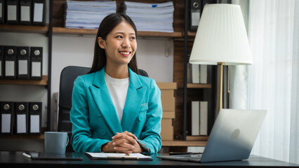 Young chinese business woman doing bookkeeping analyst audit working papers, public offering, cash...
