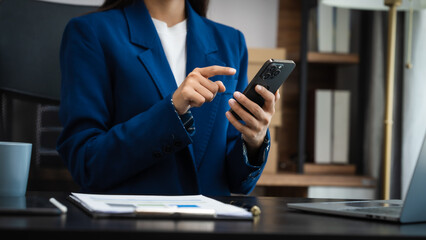 Young chinese business woman doing bookkeeping analyst audit working papers, public offering, cash budget, accrued dividend, note payable, actual cost, aging schedule, intangible fixed asset