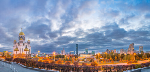 Fototapeta premium Temple in autumn in beautiful orange sunset light. Temple on Blood, Yekaterinburg, Russia