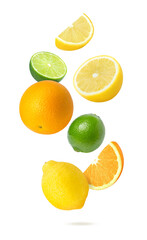 Orange, lemon, lime falling isolated on white background.