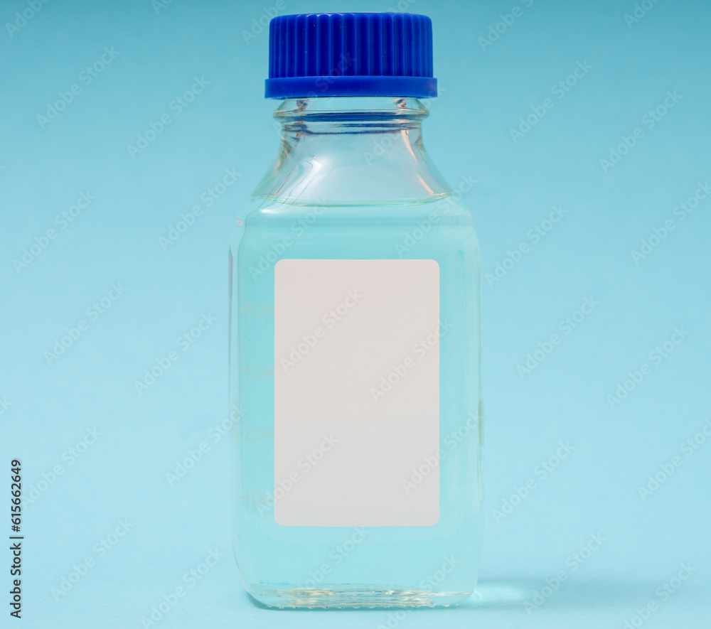 Poster transparent glass bottle for chemical or biological substances on a blue background