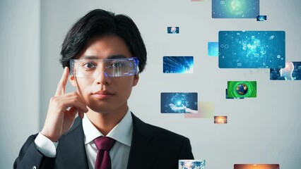 A man watching at a holographic image with VR goggles. - Powered by Adobe