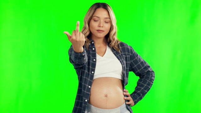 Pregnant, green screen and woman with middle finger in studio for angry, upset and rude gesture. Pregnancy, maternity and portrait of female person on chromakey background with offensive hand sign