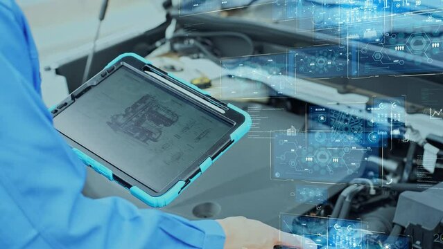 Auto mechanic inspecting the engine room and digital data concept.