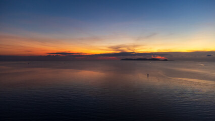 Sunrise sky over horizon in morning with colorful clouds. Orange sunlight.