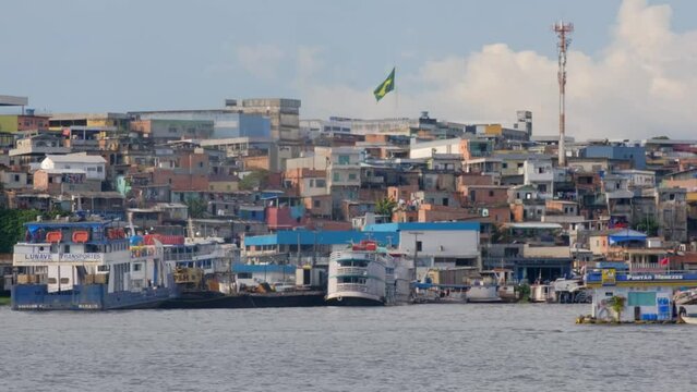 Manaus Favela, Amazonia Brazil Humble Slum Houses and Boats, River Panning View
