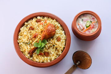 Chicken biryani Spicy Indian Malabar biryani Hyderabadi biryani, Dum Biriyani pulao golden bowl Kerala India Sri Lanka Pakistan basmati rice mixed rice dish with meat curry Ramadan Kareem, Eid