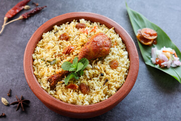 Chicken biryani Spicy Indian Malabar biryani Hyderabadi biryani, Dum Biriyani pulao golden bowl Kerala India Sri Lanka Pakistan basmati rice mixed rice dish with meat curry Ramadan Kareem, Eid