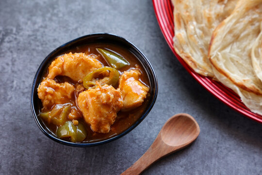 Kerala parathas / porotta / roti / parotta / barotta/ naan layered flatbread made from maida or whole wheat flour. Eat with spicy Asian chicken or beef or egg curry gravy. breakfast dish. Indian food.