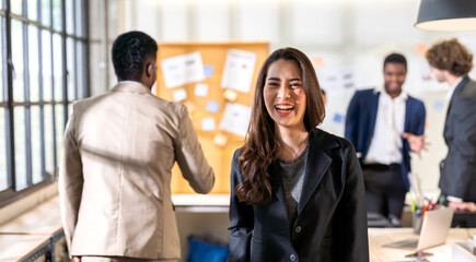 Portrait of smiling happy relax profile asian beauty attractive confident young businesswoman, fashionable, model, girl, creative female look at camara enjoying standing at office