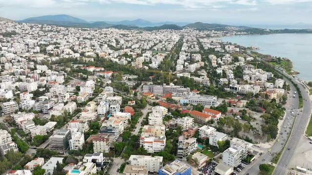 Drone flyover waterftront Glyfada cityscape, Greece