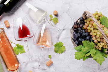 White, rose and red wine glasses and bottles