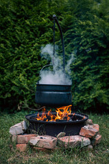 Stew pot at open fire outdoor