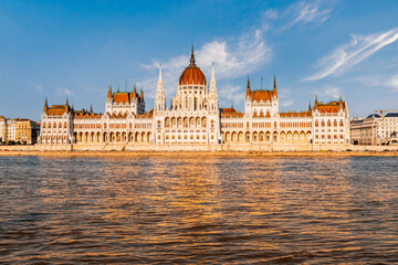 Fototapeta na wymiar Parliament building in Budapest with fantastic perfect sky and reflection in water. calm Danube river. Popular Travel destinations.