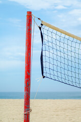 partial view of a volleyball net on the beach, summer concept