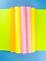 Colorful paper sheet background  isolated on blue, close up