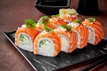 Philadelphia rolls with salmon served with gari and soy sauce