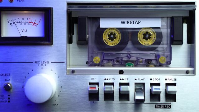 Playback of Audio Cassette Tape With Wiretap Recording in Vintage Deck Player WIth VU Meters, Close Up
